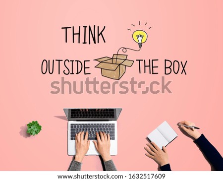 Think outside the box with people working together with laptop and notebook
