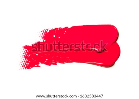 A trace of red lipstick on a white background.