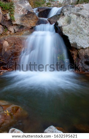 Waterfall of silk water in a river of Extremadura