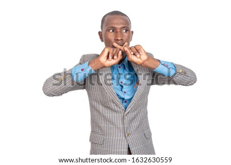young businessman in jacket standing on white background crossing fingers making rejection sign.