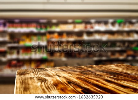 Table background of free space for your decoration and blurred interior of shop.Copy space for your product and shoping time. 