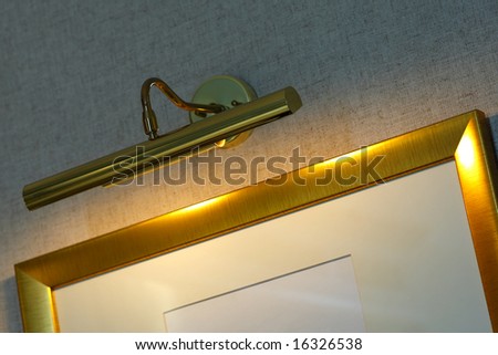 Gold picture frame with lamp