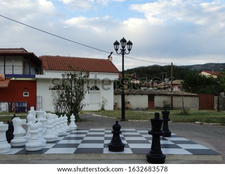 sivota. huge chess board game pawns king queen horse white and black free outdoor play in town of sivota greece epirus close o igoumenitsa
