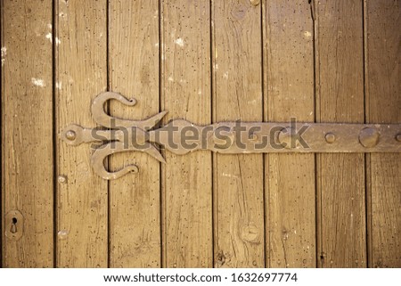 Wooden door with ancient lock, construction and architecture