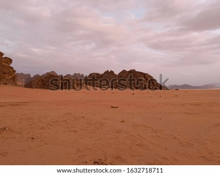 beautiful sky with mountains and sand