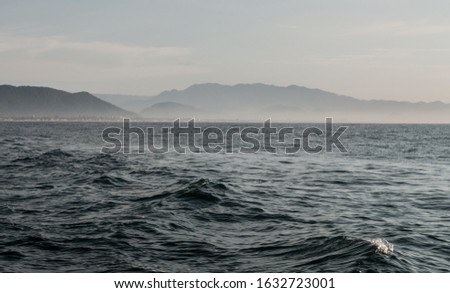 
Sea ​​water with city mountains in the background