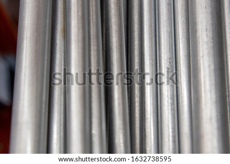 Vertical pipes with shadows and highlights