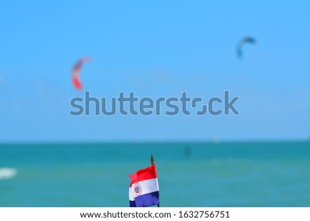 Beautiful National Flag of Paraguay on Tropical Beach
