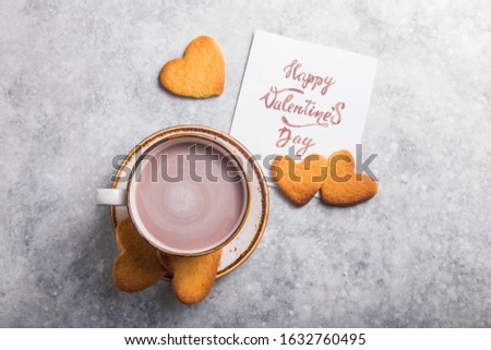 Cup of fresh morning coffee or cacao  with Valentine's day card, selective focus, horizontal, copy space.