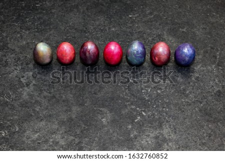 Marbled Easter eggs on black background