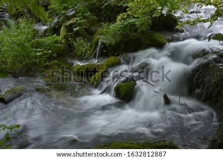 Small waterfall flowing through the woods. At Plitvička Jezera city,Croatia .In September 2019.
