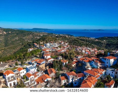 Aerial view over the amazing old village or Chora of Alonissos island against a deep blue sky. Sporades, Aegean sea, Greece