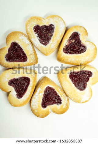 Sugar cookies in the shape of hearts for Valentine's Day. White background.