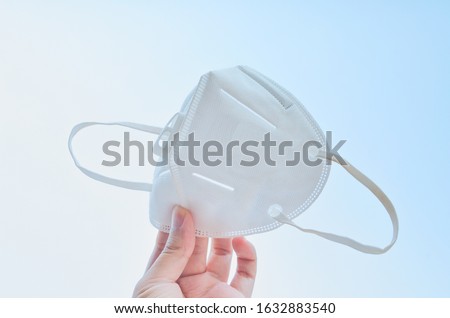 KN95 or N95 mask for protection pm 2.5/pm2.5 and corona virus (COVID-19).Anti pollution mask.air face mask. Royalty-Free Stock Photo #1632883540