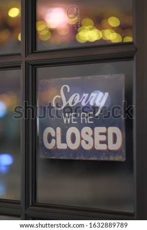 Close up of closing sign on window