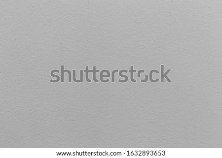 closeup surface detail of white plaster concrete wall texture background with light on top, bright empty space and rough finishing for backdrop design decoration in architectural material concepts

