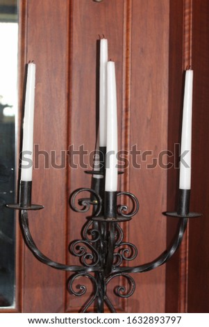 Candle holder with long white candles 