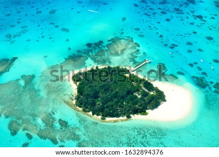 Wide aerial view of Managaha Island, a famous destination close to Saipan, Northern Mariana Islands.  Royalty-Free Stock Photo #1632894376