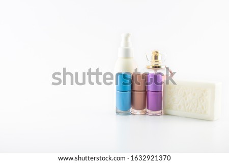 Set of plastic bottles of body care and beauty products. Filmed in studio against white background. Taken in studio against white background. There are glass plastic bottles.