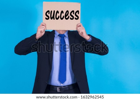 businessman with banner and text, concept of success in business
