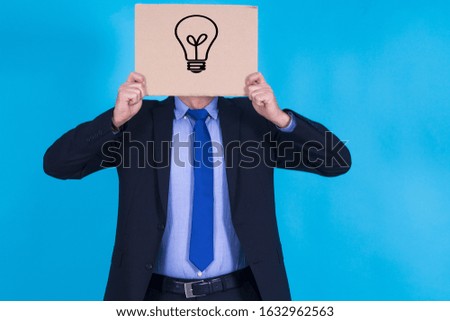 businessman with banner and a light bulb, idea and business concept