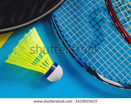 Close up photos, Yellow plastic badminton ball and Badminton racket