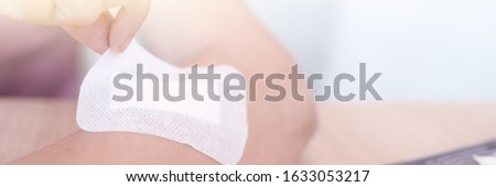 Injured hand arm of the girl tied up by white bandage. injures hand wound dressing a plaster on hand. Bandaged the wound. Concept of healthcare provision of first aid accident.
 Royalty-Free Stock Photo #1633053217