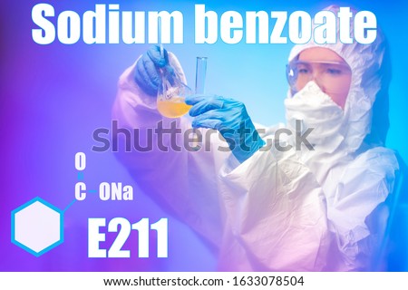 Sodium benzoate. Chemical. Food additive. Preservative. E211. The girl is a chemist holding a test tube and flask with chemical substances. Chemical formula of sodium benzoate.