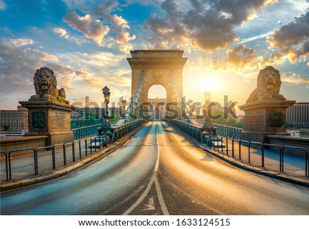 Statues of Lions on Chain Bridge in Budapest at sunrise, Hungary Royalty-Free Stock Photo #1633124515