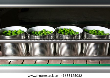 Working process of the production of green peas on cannery. Movement on the conveyor. Royalty-Free Stock Photo #1633125082