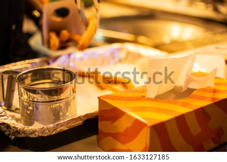 a table with tissue and sweet after meal items