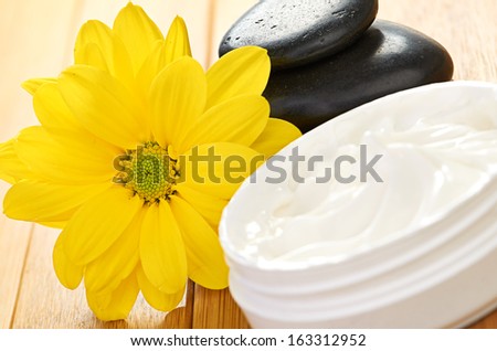 cosmetic cream with herbal flower