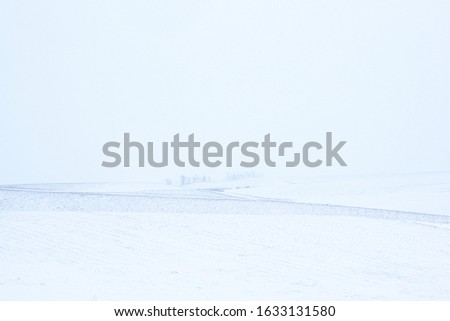 Winter snow minimalistic landscape. Horizon. Field. Lines.