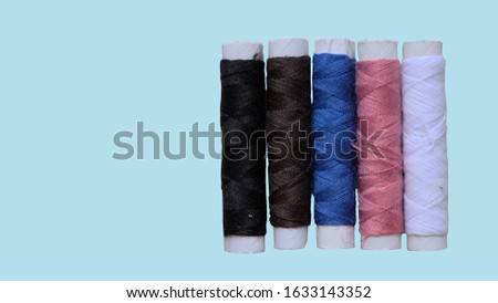 Colored of yarn on sky background . Yarn for knitting.