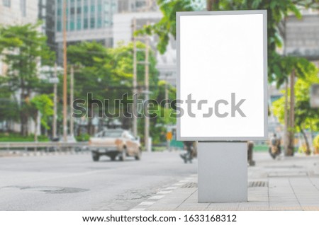 led blank billboard white screen side road in city. ad mockup copy space for advertising banner near bus stop in metropolis.