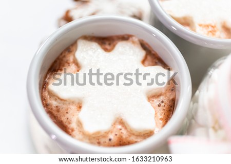 American hot chocolate with snow flake shaped marshmallow toppings.