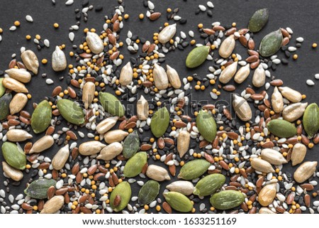 Healthy Seeds Mix for Salads and healthy dishes. Pile of mixed seeds as background, close up.