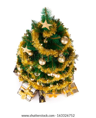 Isolated shot of christmas tree with gifts on white background