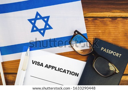 Flag of Israel , visa application form and passport on table