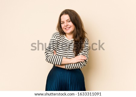 Young curvy woman laughing and having fun.