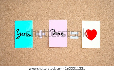 You and me text on notepad, Love and romantic concept for Valentine’s Day on notice board Royalty-Free Stock Photo #1633311331