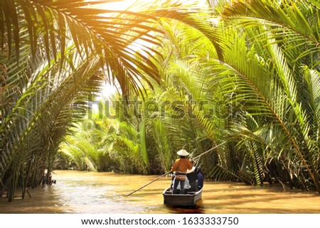 People boating in the delta of Mekong river, Vietnam, Asia