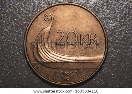 Norwegian metal coin with denomination of five Norwegian kroner