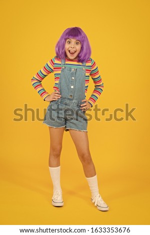 Cosplay outfit. Otaku girl in wig smiling on yellow background. Happy childhood. Anime fan. Cosplay kids party. Child cute cosplayer. Cosplay character concept. Culture hobby and entertainment.
