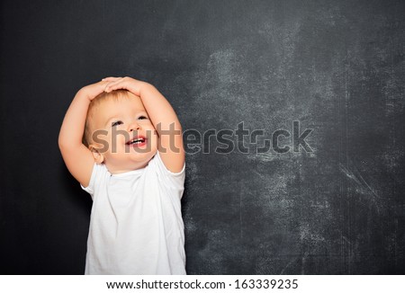 baby child and an empty Blackboard