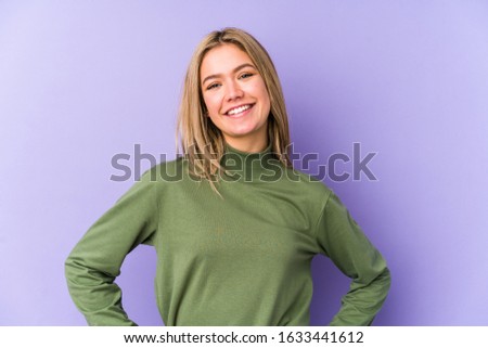 Young blonde caucasian woman isolated confident keeping hands on hips.