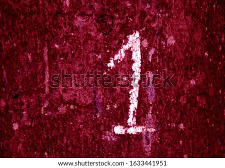 Hand written number one on pink grungy wall. Signs and symbols background