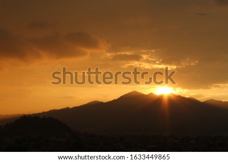 Photograph of mountains in sunset