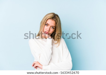 Young blonde caucasian woman isolated who is bored, fatigued and need a relax day.