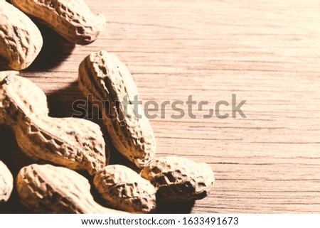 Close up of a grouped raw peanuts 